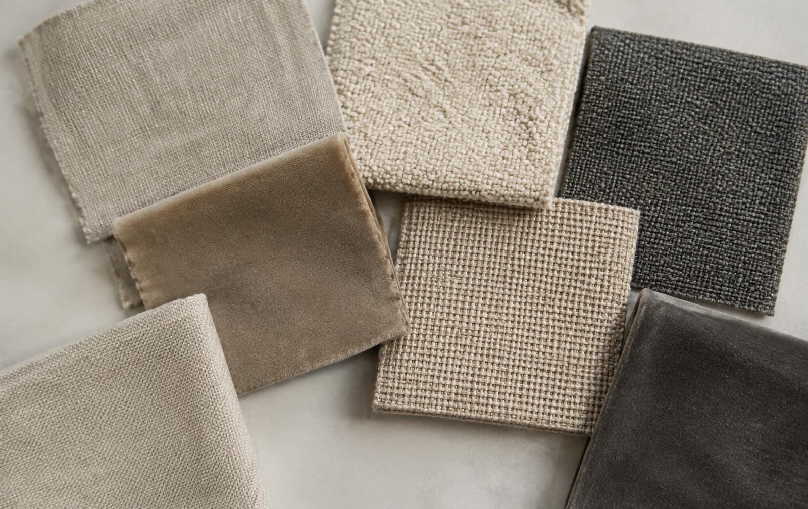 Upholstery fabric swatches in linen, bouclé and velvet