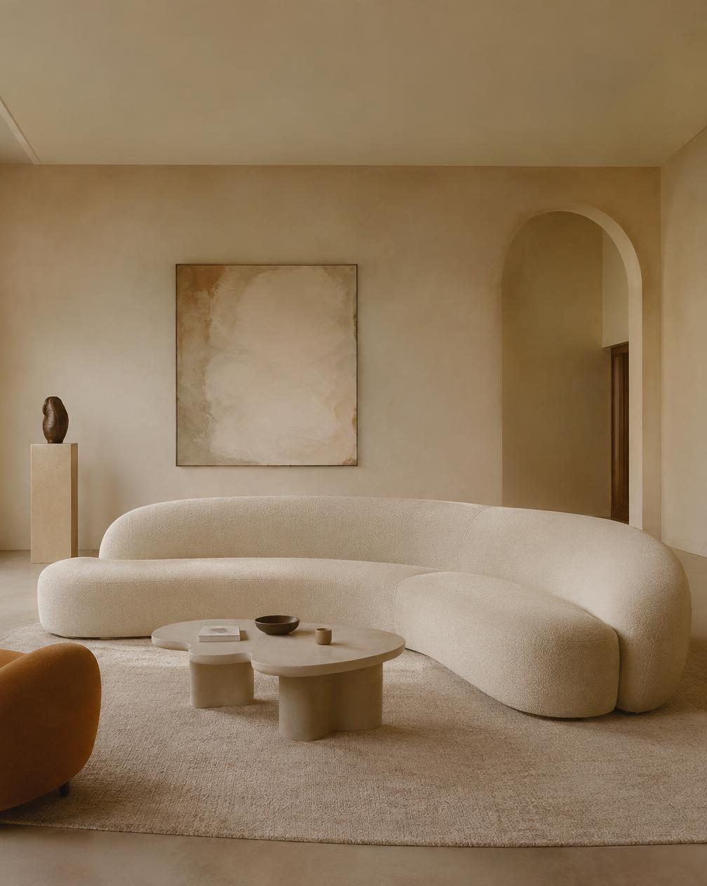 Curved ivory bouclé sofa in a calm living room